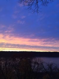 Scenic view of calm lake at sunset