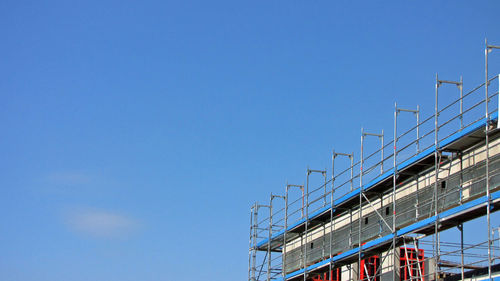 Low angle view of built structure against blue sky