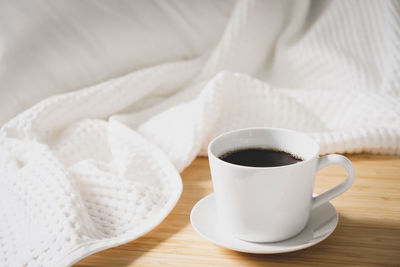 High angle view of coffee cup on table