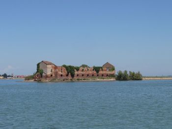 Scenic view of sea against clear blue sky