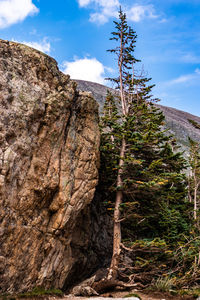 Low angle view of rock formation on mountain against sky