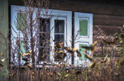 Damaged window of old abandoned building