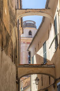 Ancient street with arches in the historic center of diano castello