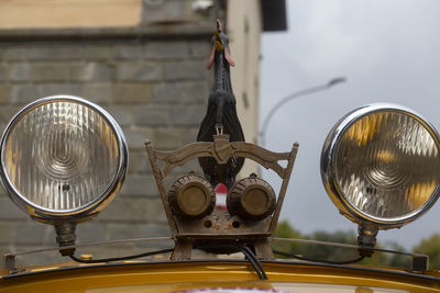 Close up of headlights and roaster mounted on the roof top of a vehicle