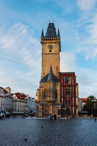 View of prague old town hall and clock tower against sky early morning