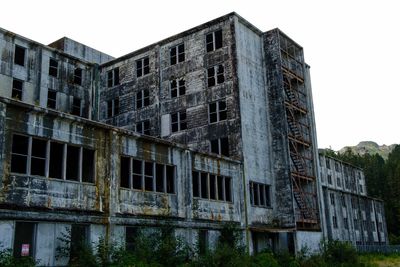 Low angle view of old building against clear sky