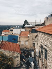 High angle view of buildings against sky in town