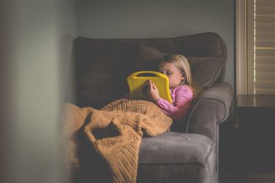 Girl playing on sofa