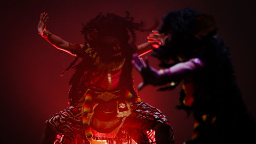 Dancers wearing traditional balinese reog clothes typical of indonesia dancing at the festival