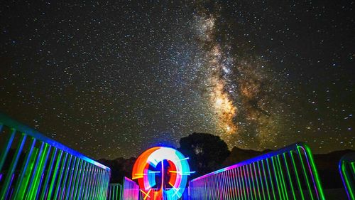 Low angle view of moon against blue sky