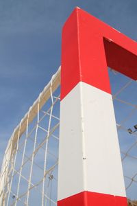 Low angle view of goal post against sky