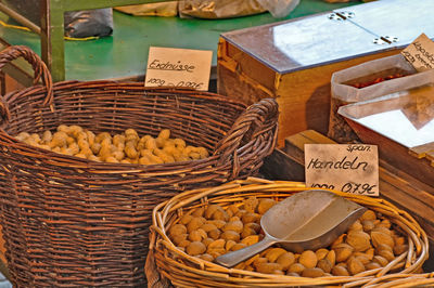 High angle view of nuts in wicker basket at store for sale