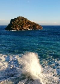 Scenic view of sea against clear blue sky