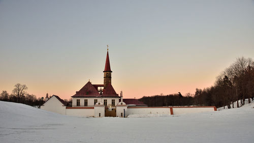 Panoramic view of building against clear sky during winter