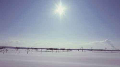 Scenic view of snow covered landscape against sky