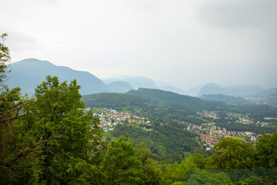 View over landscape with mountain range and village in ticino, switzerland.