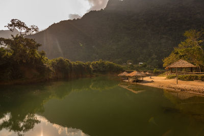 Scenic view of lake and mountains against sky