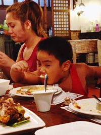 High angle view of woman sitting in restaurant