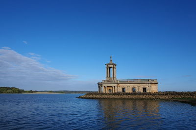 View of lighthouse against blue sky