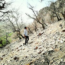 Full length of woman standing on rock