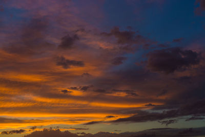 Low angle view of dramatic sky during sunset