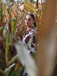 Young woman standing on field