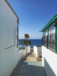 View of swimming pool by sea against clear sky