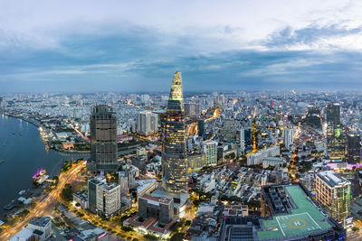 Aerial view of illuminated buildings in city at night