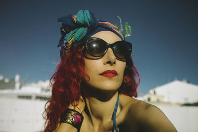Close-up of beautiful young woman wearing sunglasses