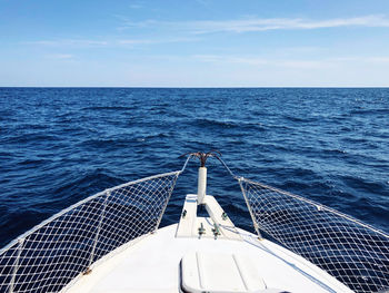 Sailboat sailing in sea against sky