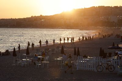 Scenic view of beach against sky during sunset