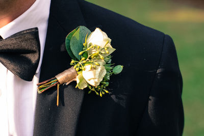 Close-up of hand holding flowers