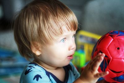 Close-up portrait of cute boy looking away