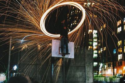 Blurred motion of illuminated ferris wheel