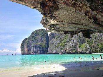 Scenic view of sea against rock formation