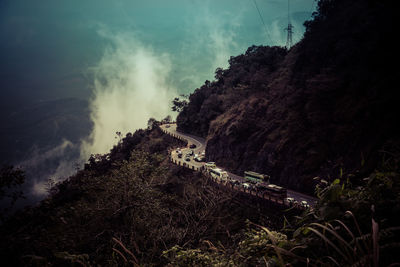 Cars on distant winding road in india