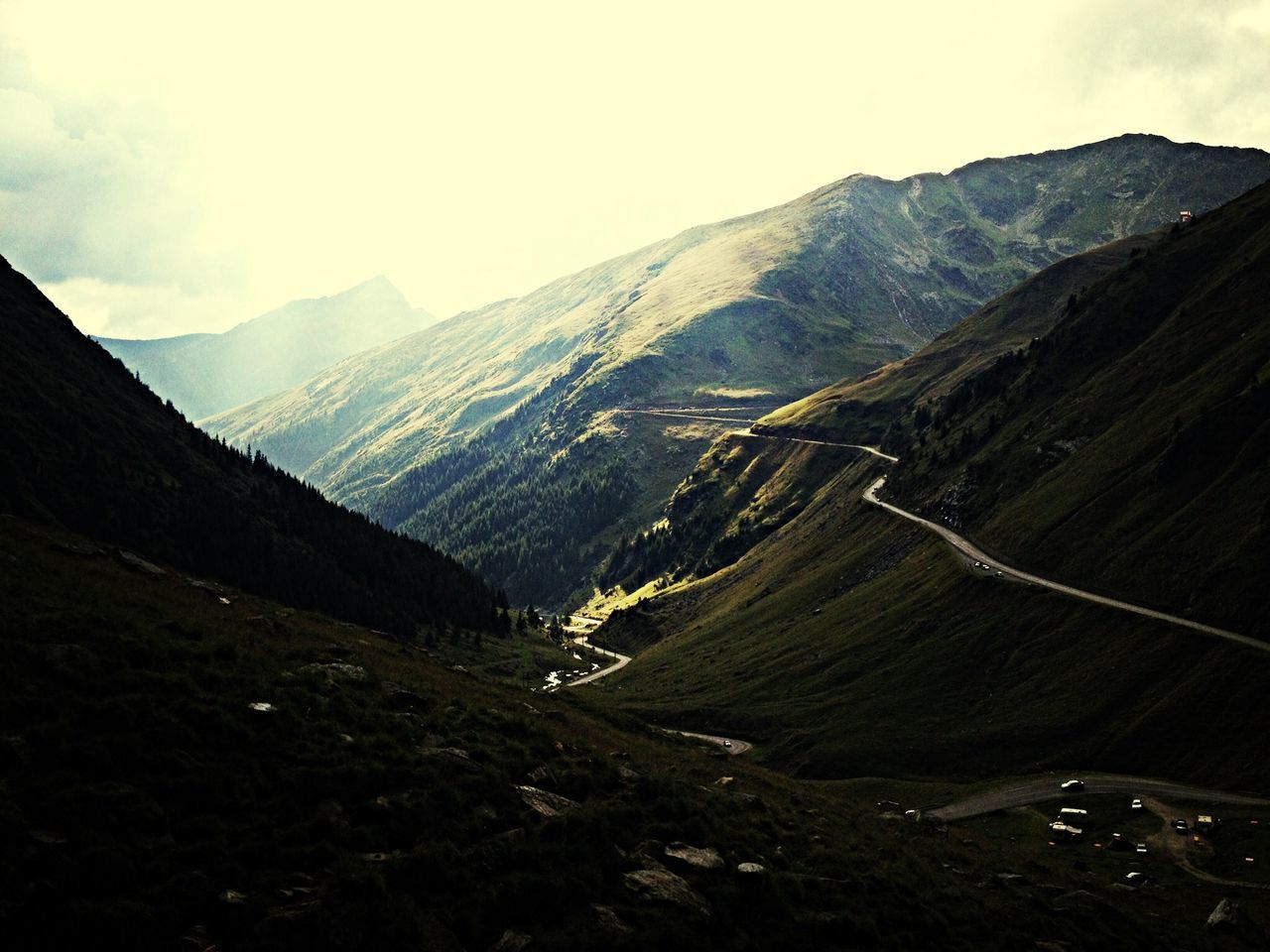 mountain, mountain range, tranquil scene, tranquility, scenics, landscape, beauty in nature, nature, non-urban scene, sky, valley, physical geography, remote, idyllic, geology, outdoors, day, high angle view, countryside, road