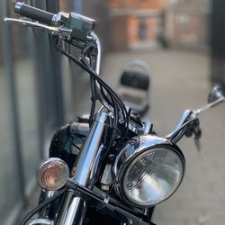 Close-up of bicycle parked on street