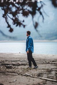 Full length of man standing on beach