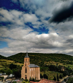 View of bell tower against cloudy sky