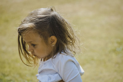 Close-up portrait of a girl looking away