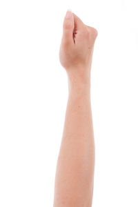 Close-up of woman hand against white background