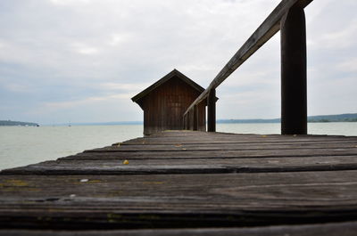 Pier over sea against sky