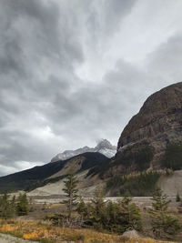 Scenic view of mountains against cloudy sky