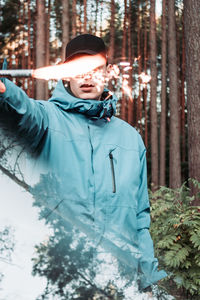 Portrait of young man in forest