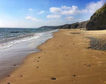 Scenic view of beach against sky