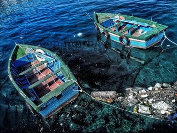 High angle view of fishing boats moored at sea