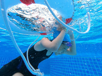 Woman swimming in pool