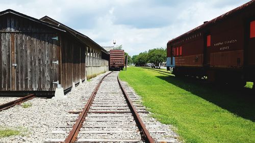 Train on railroad track against sky