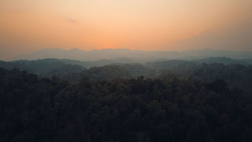 Scenic view of mountains against sky during sunset